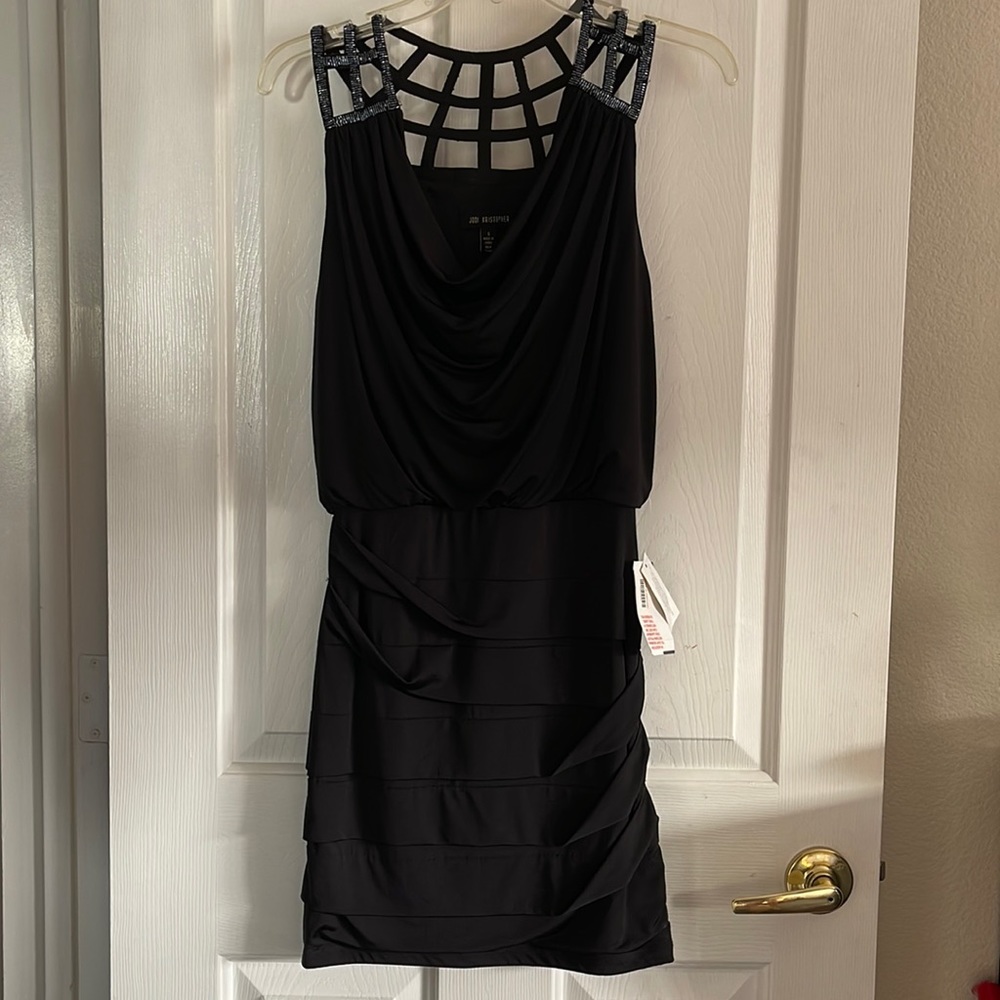 Black dress size SMALL with beaded web design. New with tags.